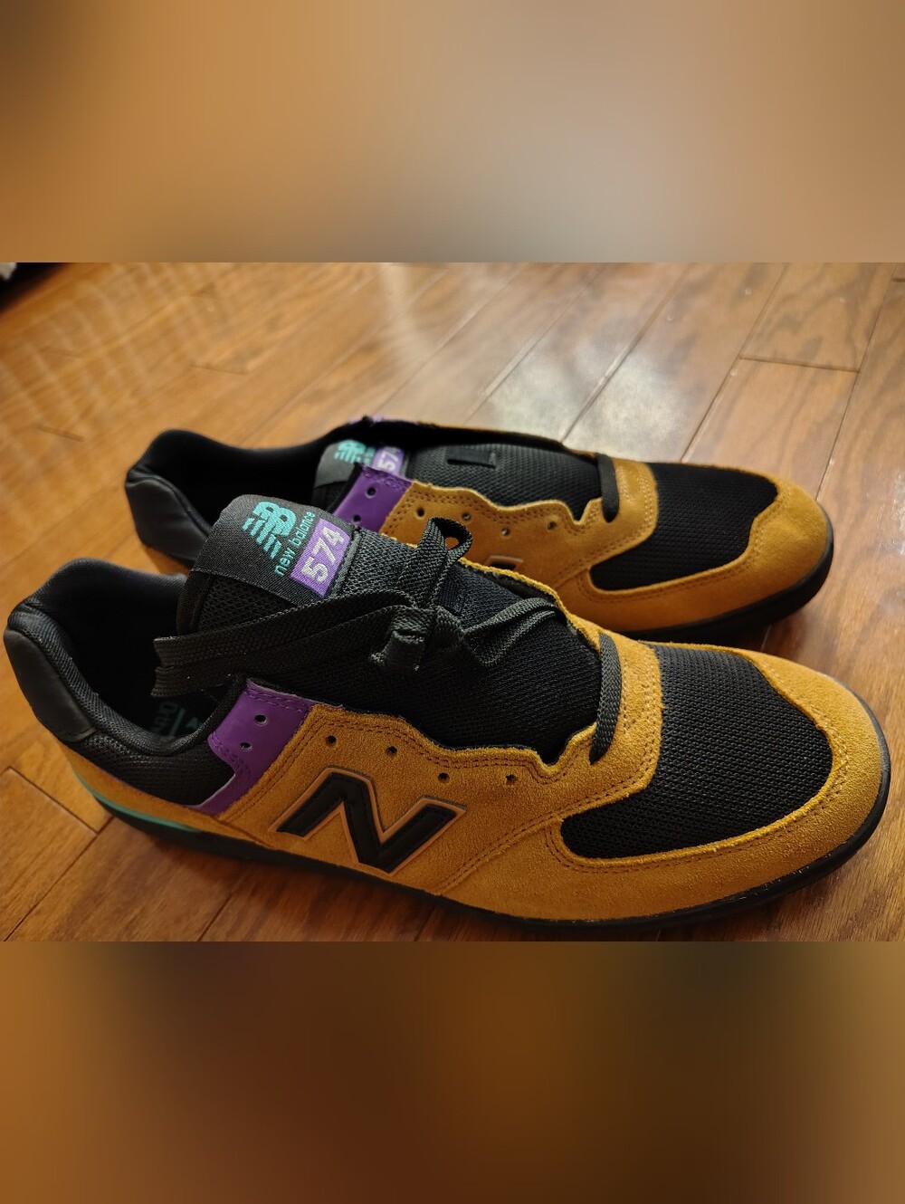 New Balance 574 Men's Black and Mustard Sneakers with Purple Accents